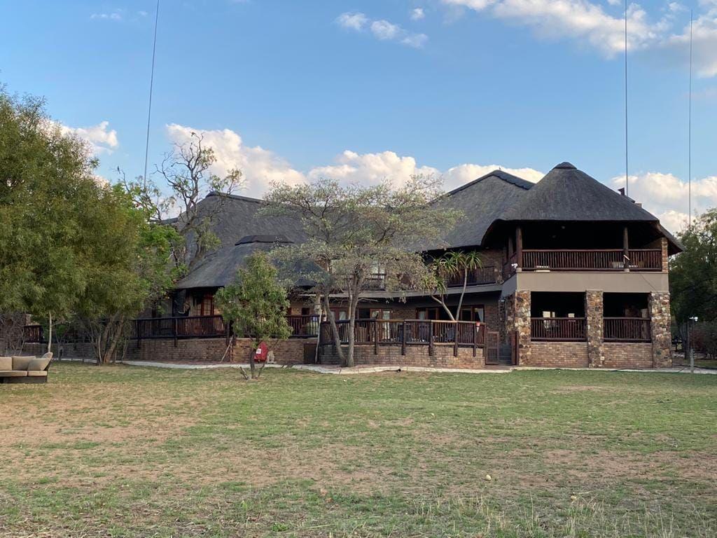 The house from the garden, under its thatched roofs