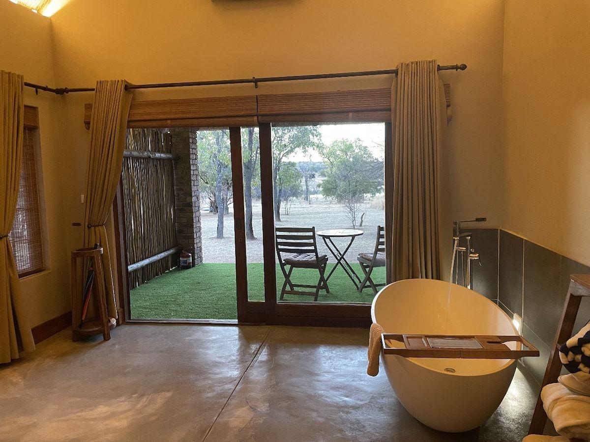 A contemporary suite opening onto a private garden patio