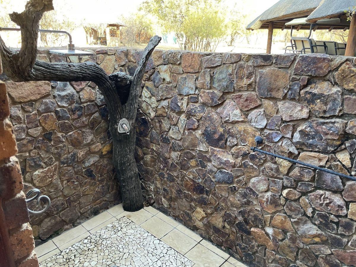 A stone walled outdoor shower
